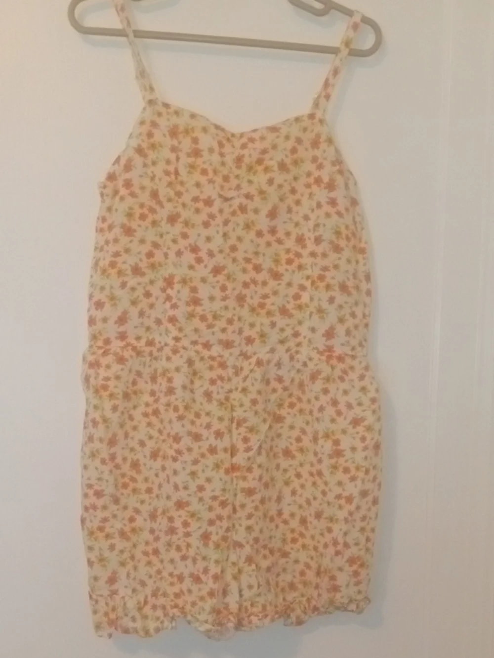 girl med bright flower print short romper